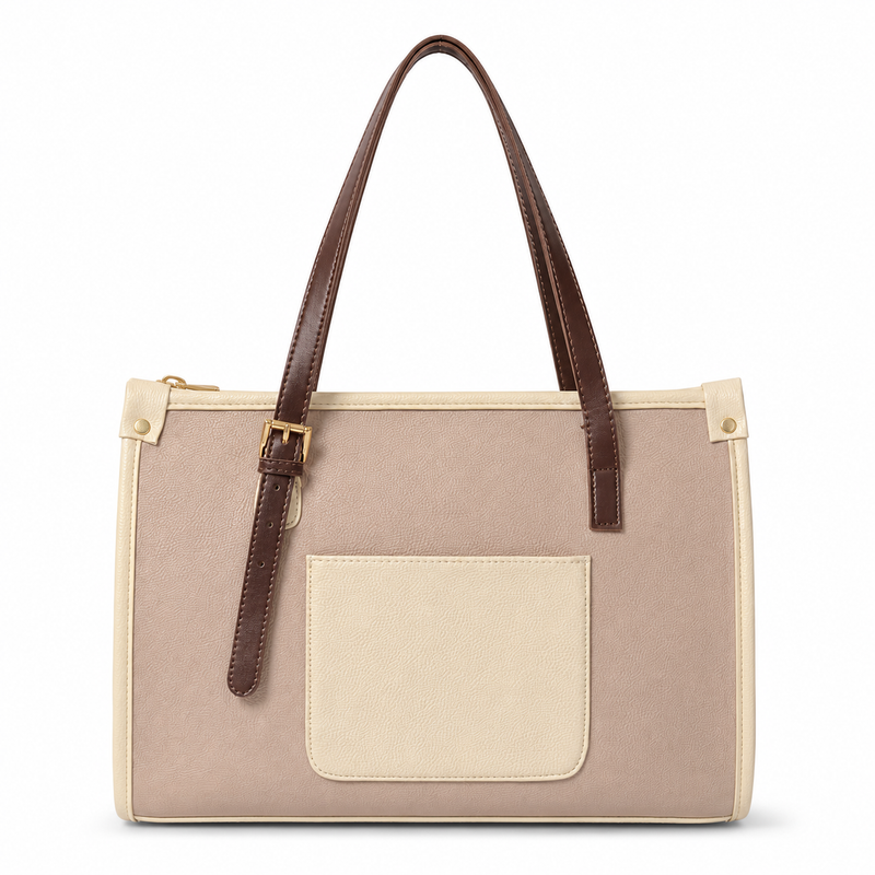 A structured tote bag in beige canvas with dark brown faux-leather handles and trim, featuring a large beige front pocket and gold-tone hardware, shown on a plain white background.
